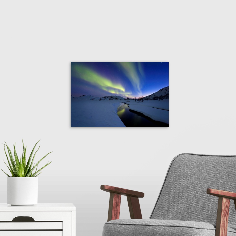 A modern room featuring Aurora Borealis over Skittendalen Valley and the Skittendalen River in Troms County, Norway. Auro...