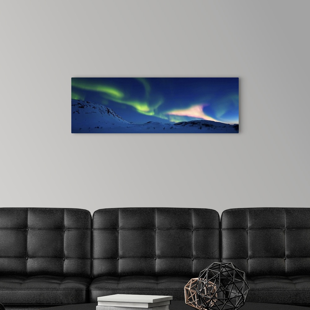 A modern room featuring Aurora Borealis over Skittendalen Valley, Troms County, Norway. Auroras are the result of the emi...