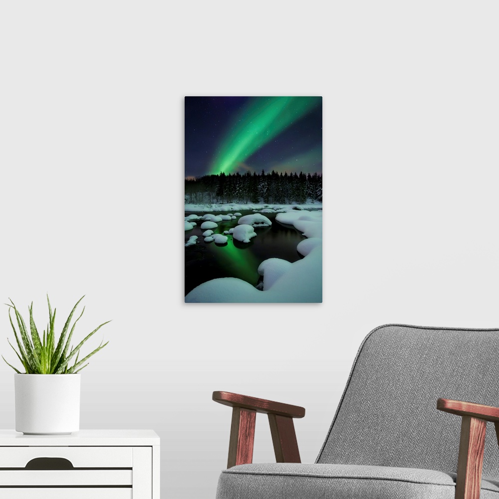A modern room featuring Aurora Borealis over Tennevik River in Troms County, Norway. Auroras are the result of the emissi...