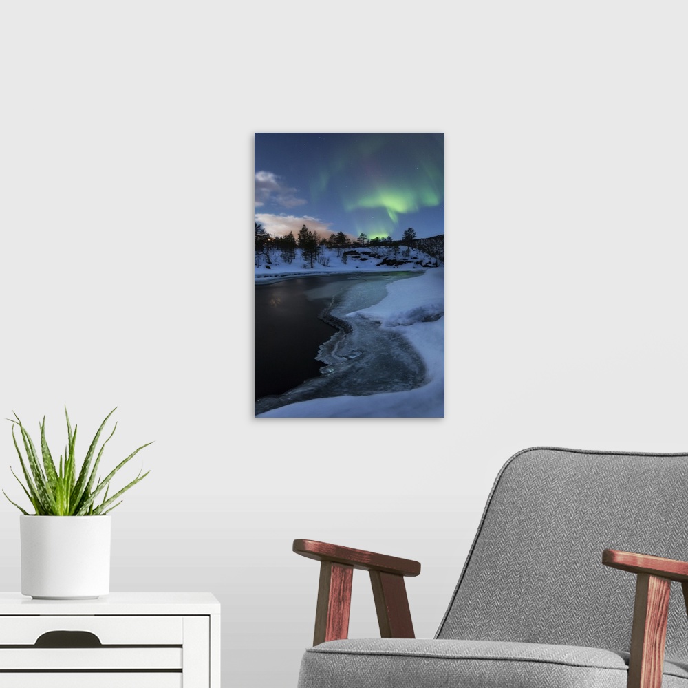 A modern room featuring Aurora Borealis over Tennevik River, Troms, Norway.
