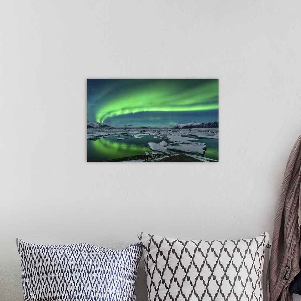 A bohemian room featuring Spectacular aurora display over the glacier lagoon Jokulsarlon in Iceland.