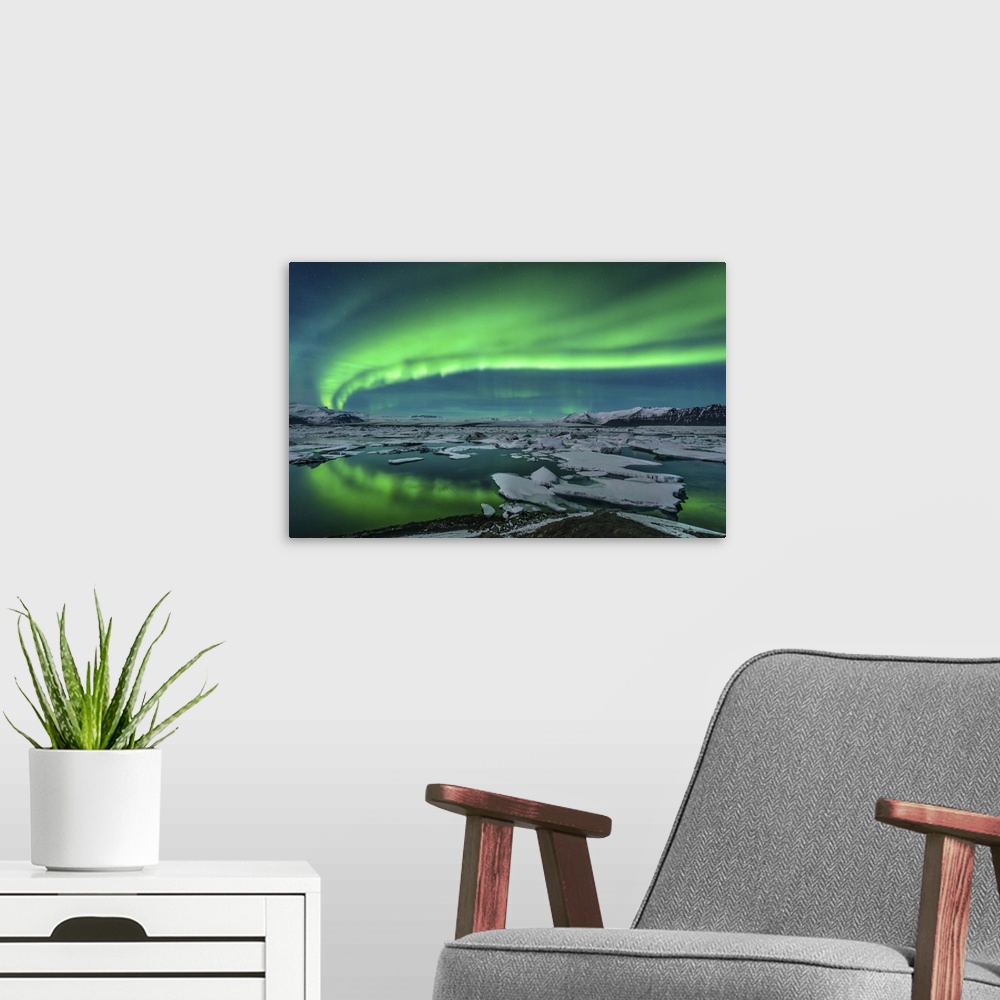 A modern room featuring Spectacular aurora display over the glacier lagoon Jokulsarlon in Iceland.