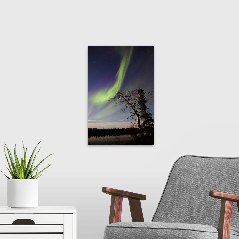 A modern room featuring Aurora borealis over the Yukon River, Whitehorse, Yukon, Canada.