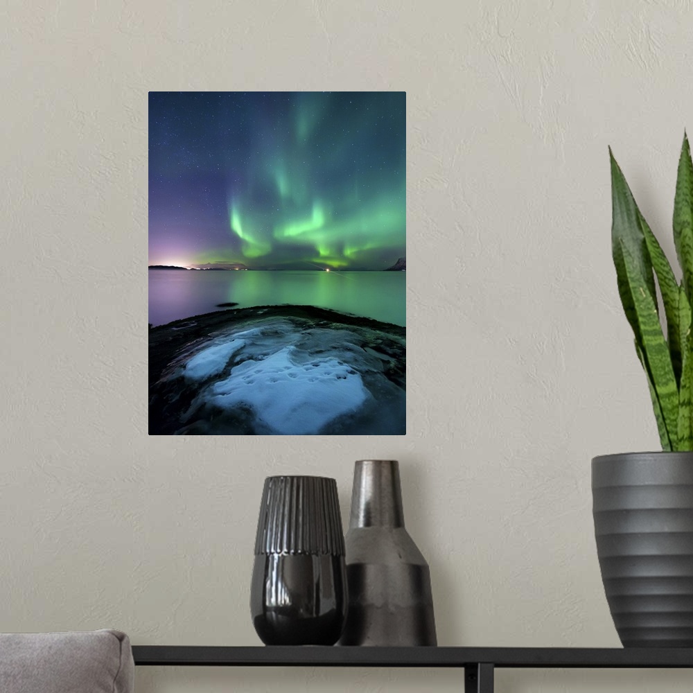 A modern room featuring Aurora Borealis over Vagsfjorden outside of Harstad in Northern Norway. Auroras are the result of...