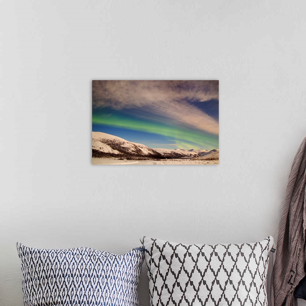 A bohemian room featuring Aurora borealis with moonlight over Ogilvie Mountains, Dempster Highway, Yukon, Canada.