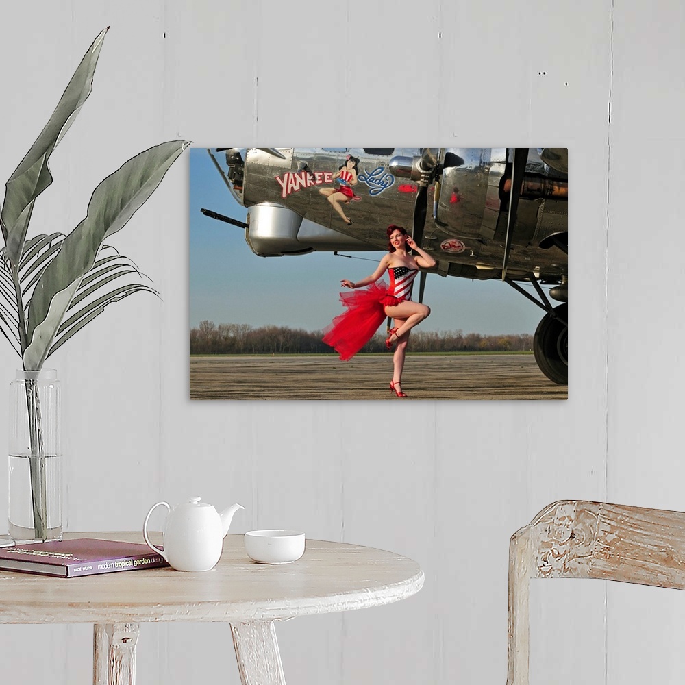 A farmhouse room featuring Beautiful 1940's style pin-up girl standing in front of a B-17 bomber.