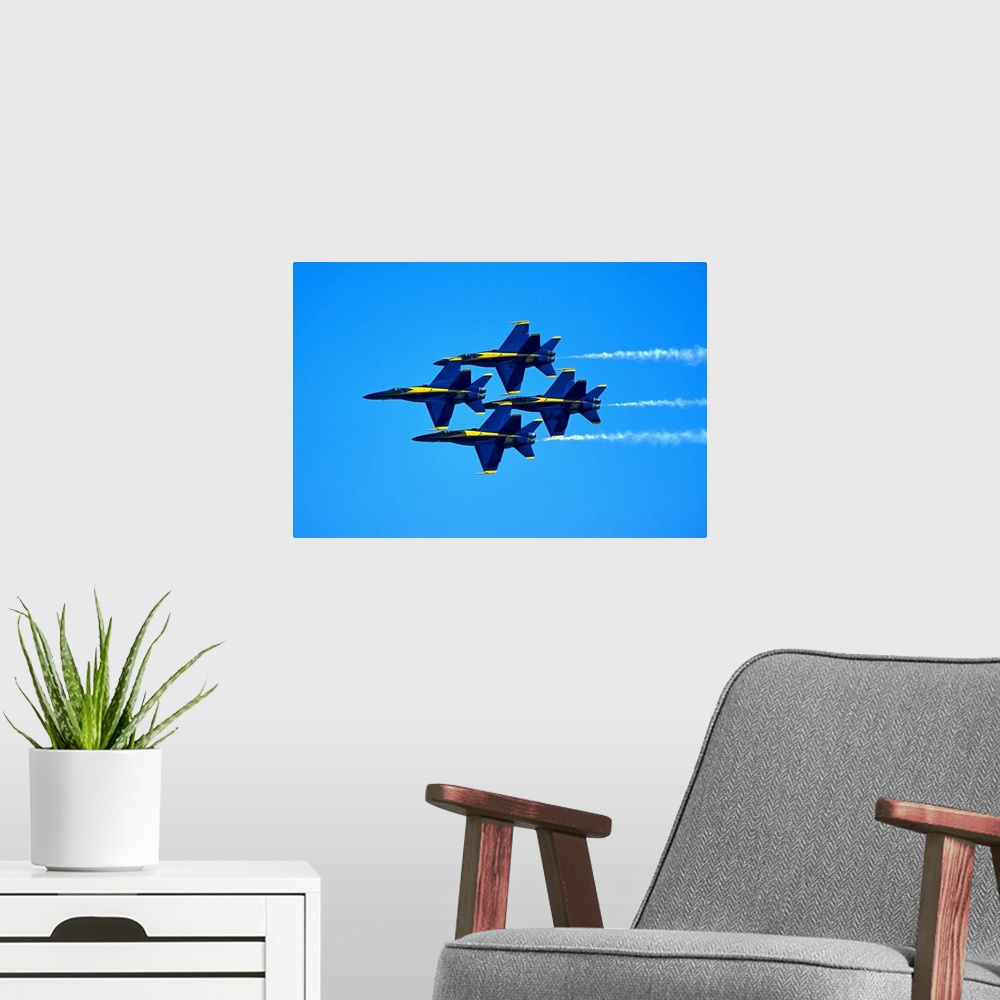 A modern room featuring Blue Angels flying in formation