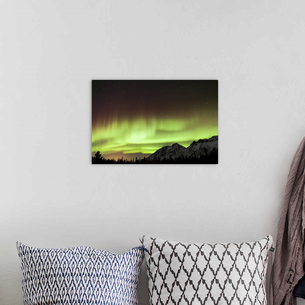 A bohemian room featuring Bright aurora borealis, Annie Lake, Yukon, Canada.