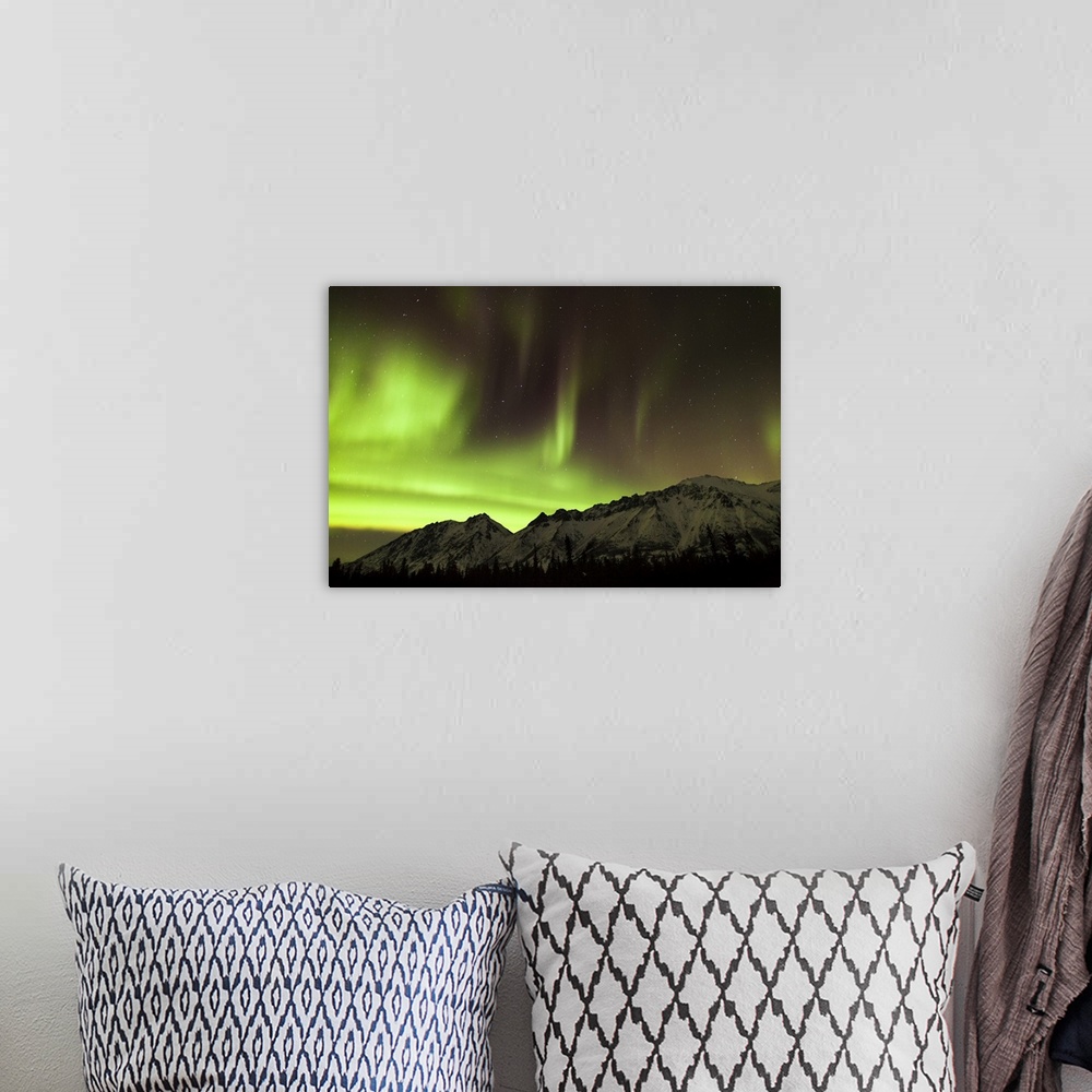 A bohemian room featuring Bright aurora borealis, Annie Lake, Yukon, Canada.