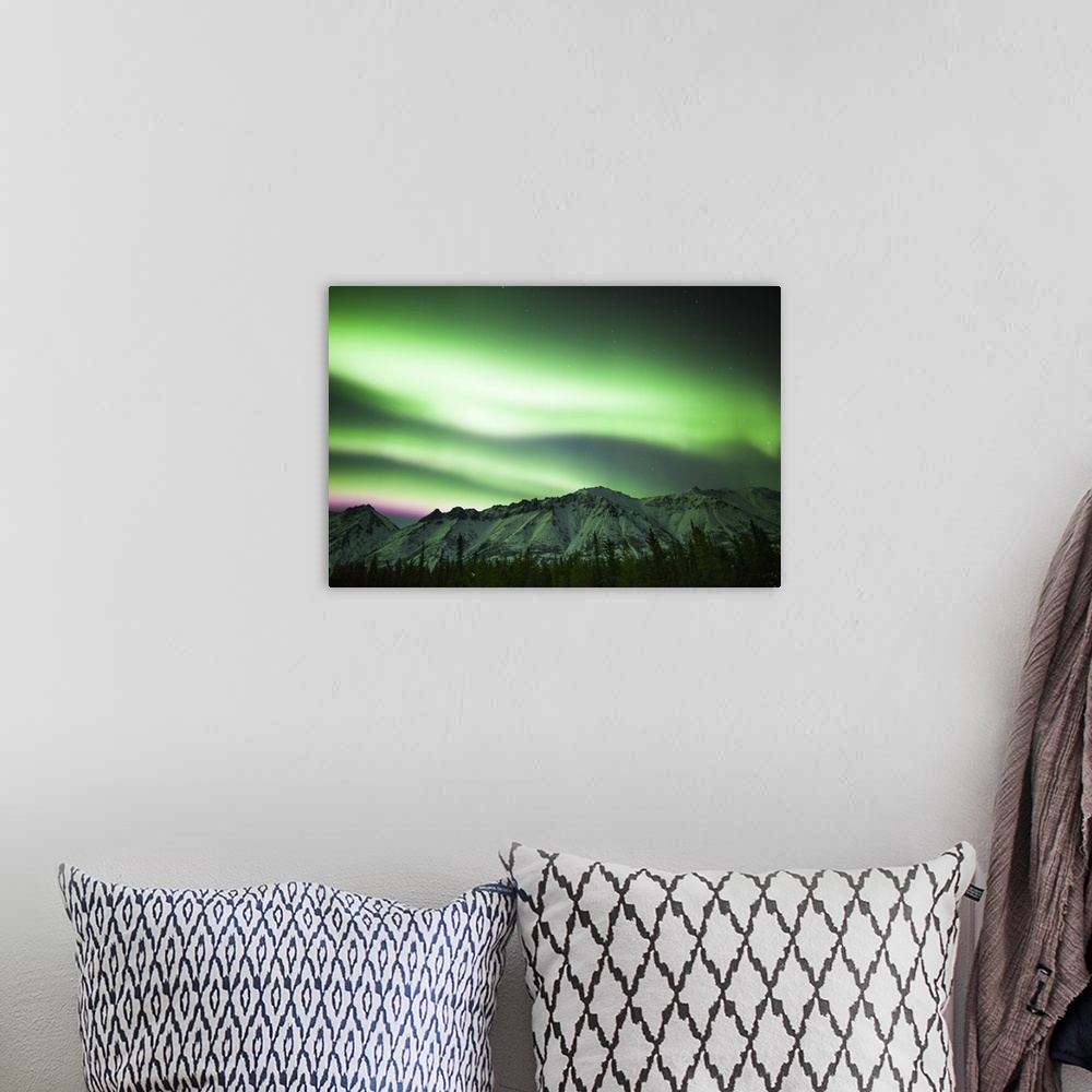 A bohemian room featuring Bright aurora borealis over Annie Lake, Yukon, Canada.