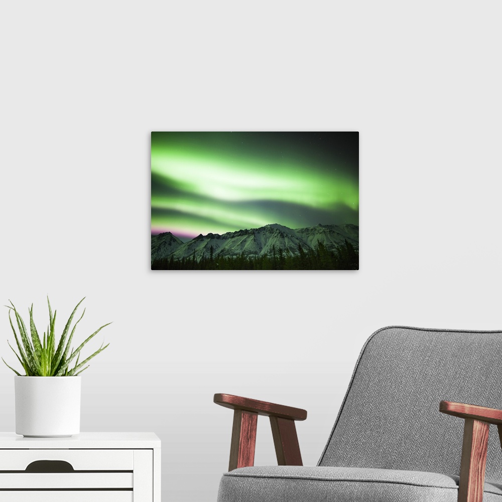 A modern room featuring Bright aurora borealis over Annie Lake, Yukon, Canada.