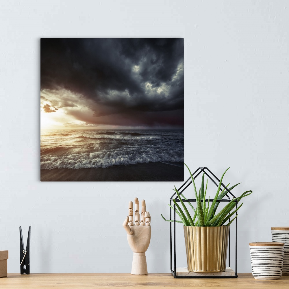 A bohemian room featuring Bright sunset against a wavy sea with stormy clouds, Hersonissos, Crete, Greece.