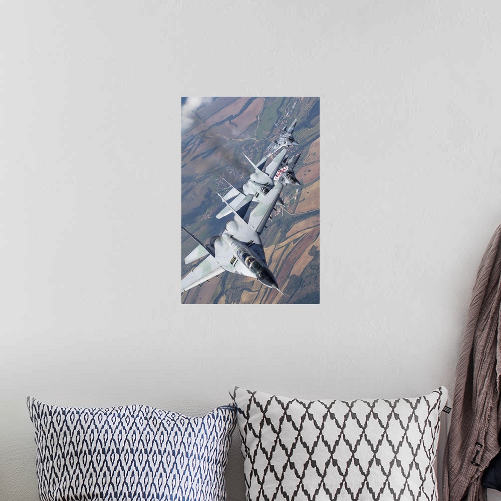 A bohemian room featuring Bulgarian and Polish Air Force MiG-29s planes flying over Bulgaria.