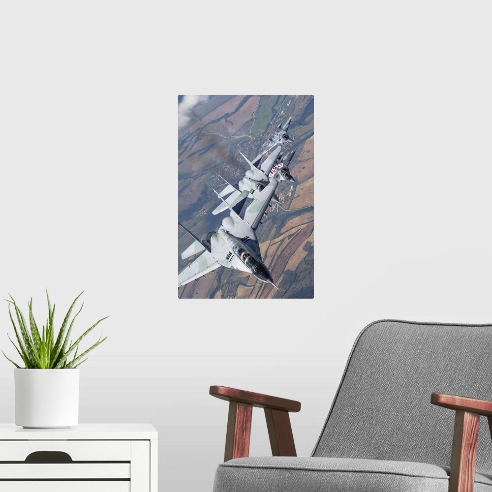 A modern room featuring Bulgarian and Polish Air Force MiG-29s planes flying over Bulgaria.