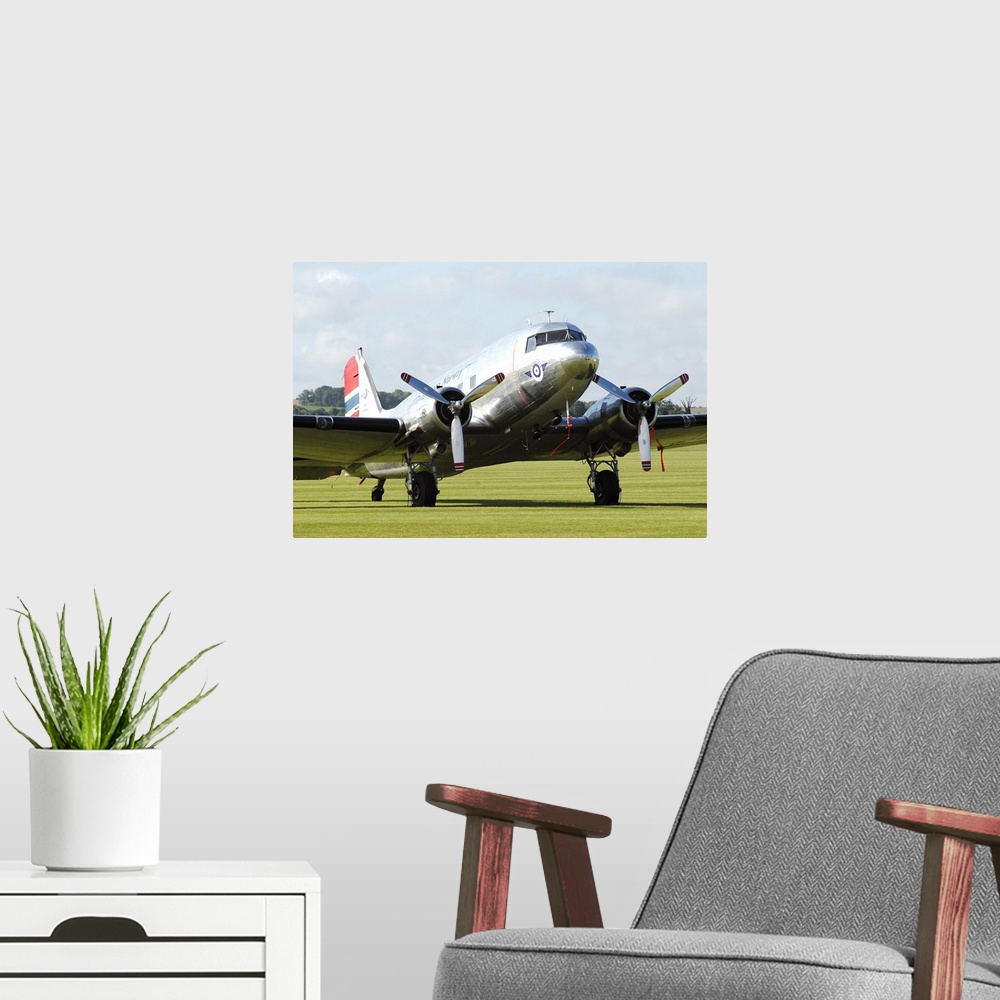 A modern room featuring Douglas C-47 Dakota in Norwegian colours taken on the airport at Duxford, England.