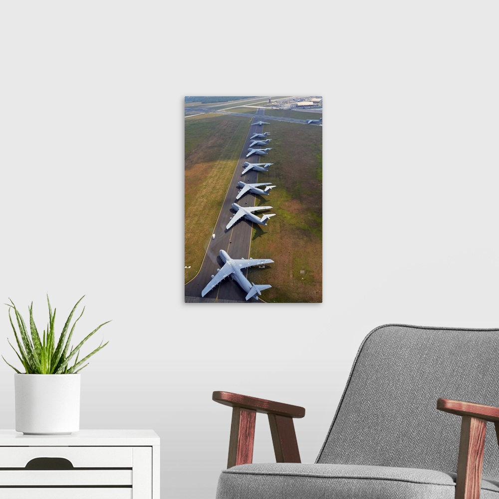 A modern room featuring August 4, 2012 - C-5 Galaxies align on the runway to make room for air show aircraft at Westover ...