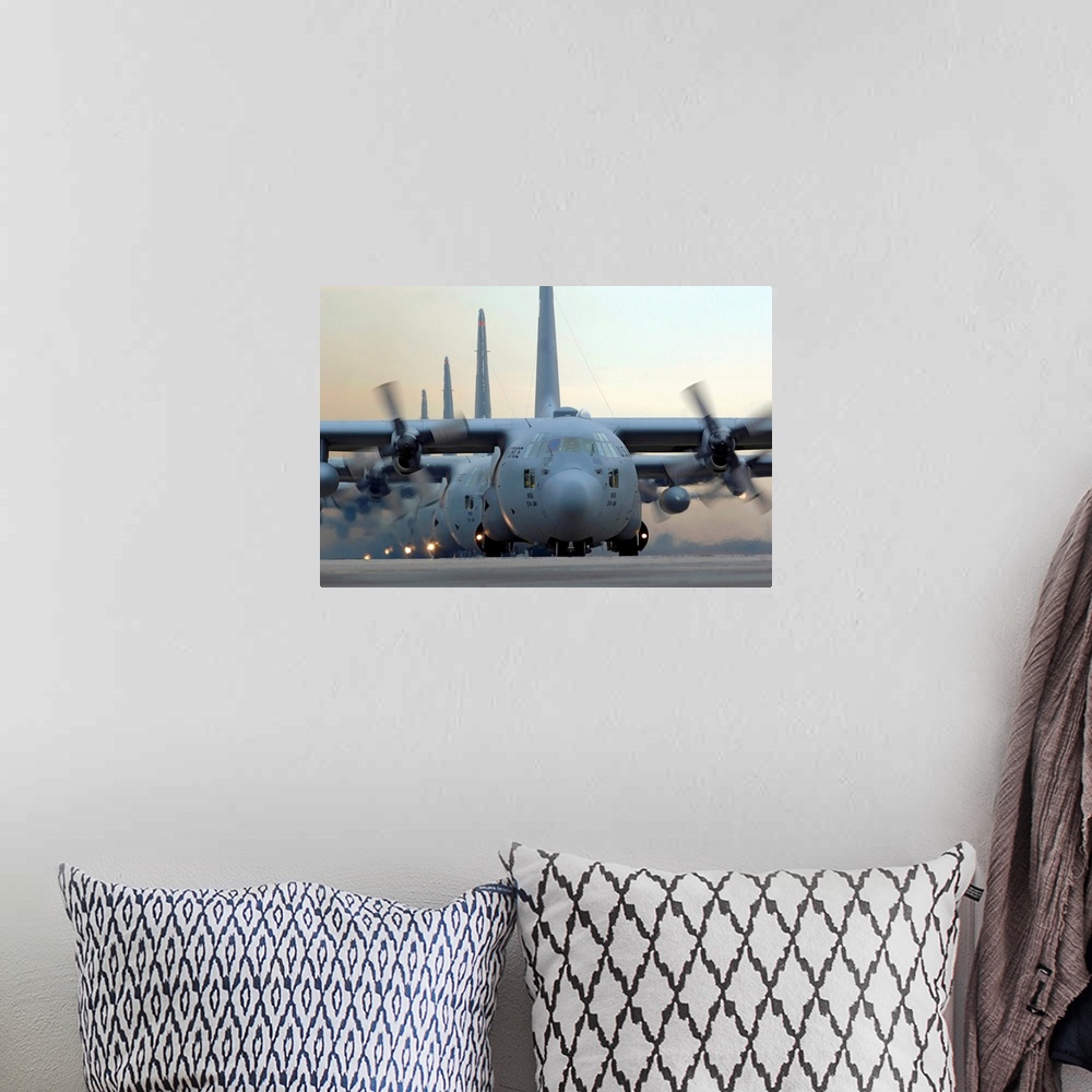 A bohemian room featuring Several of these tried and true military aircrafts line up on a runway with their massive propell...