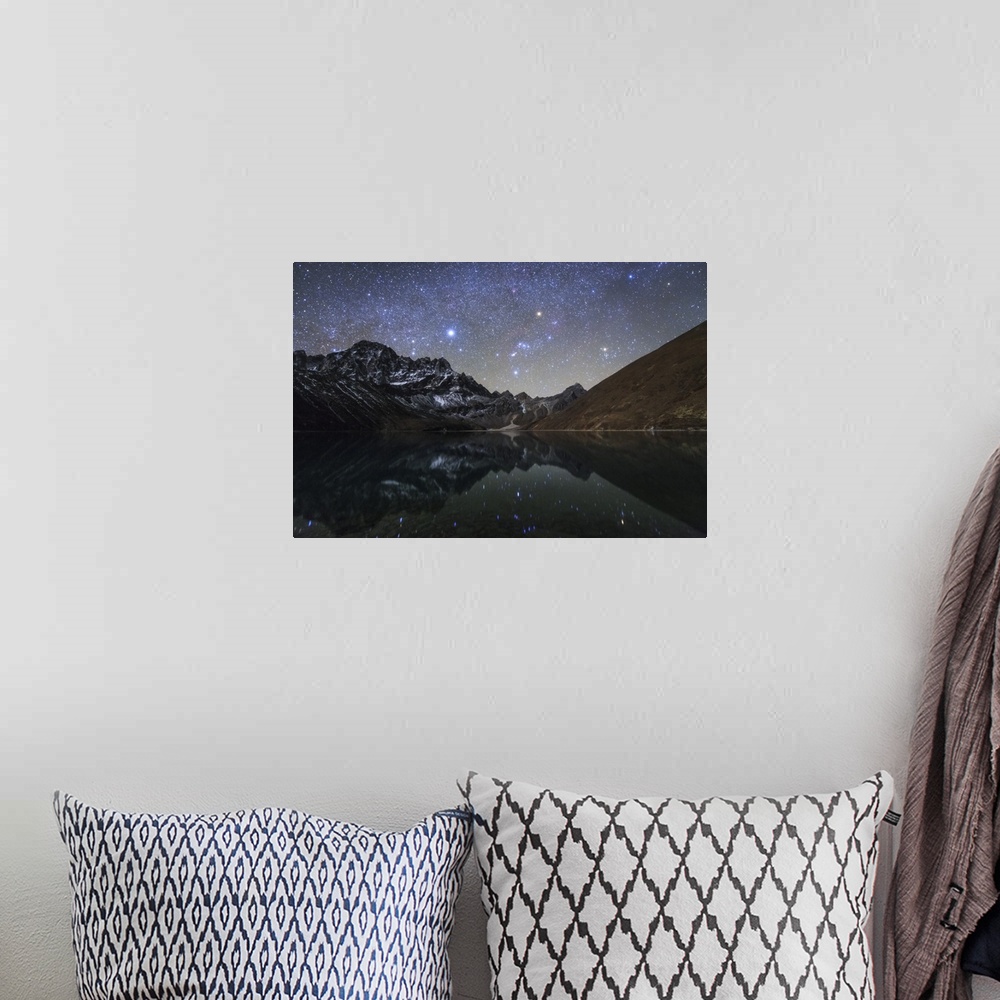A bohemian room featuring The winter Milky Way with bright Sirius, Orion and Aldebaran shining above the moonlight mountain...
