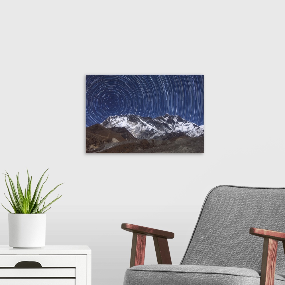 A modern room featuring A time-exposure image capturing over one hour of the Earth rotation in form of star trails (rotat...