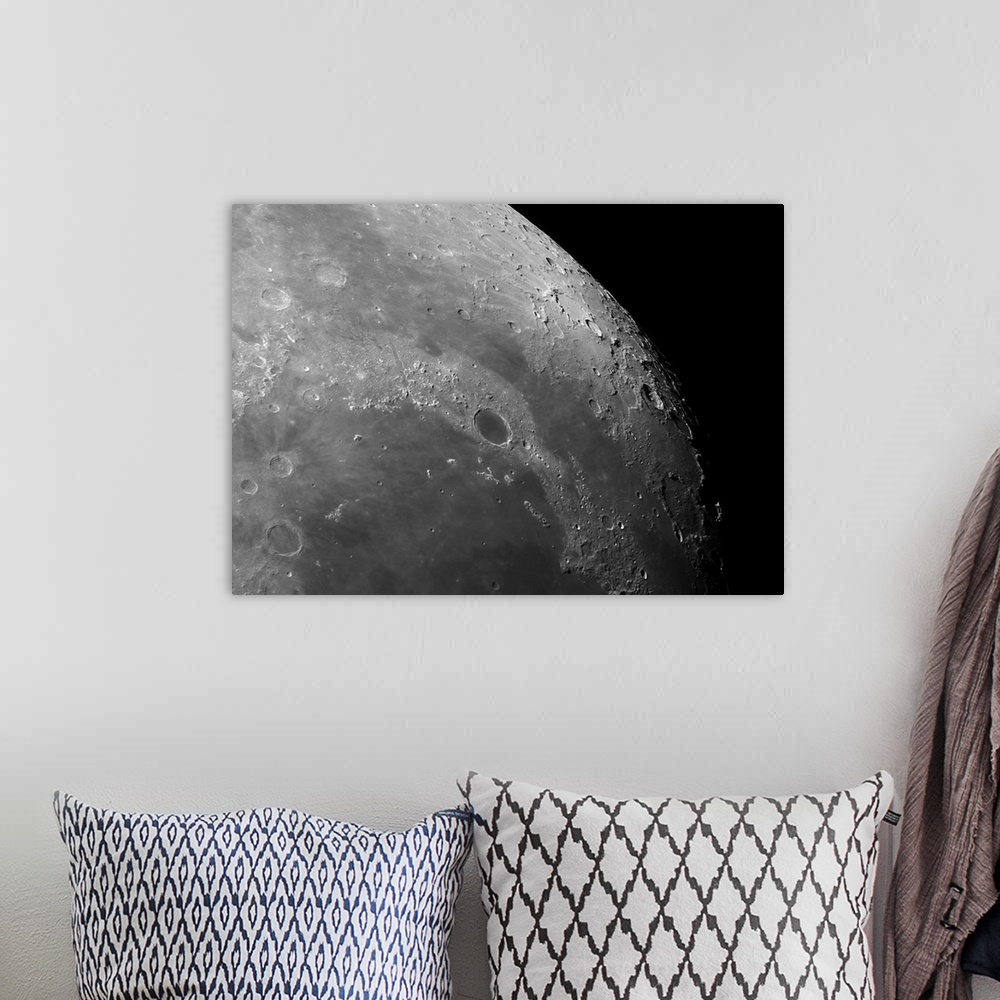 A bohemian room featuring Close-up view of the moon showing impact crater Plato.