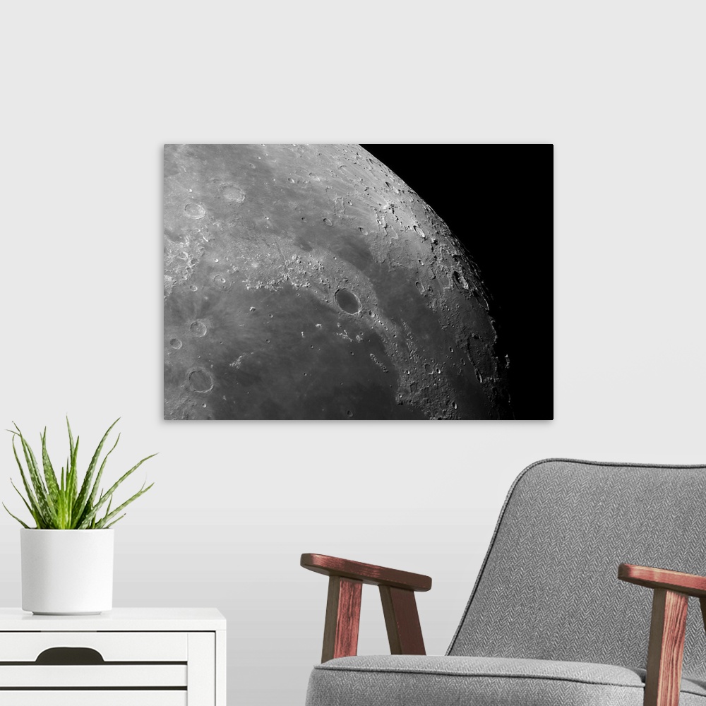 A modern room featuring Close-up view of the moon showing impact crater Plato.