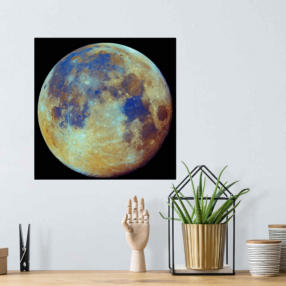 A bohemian room featuring Square photo on canvas of the moon highlighted in color on a dark backdrop.