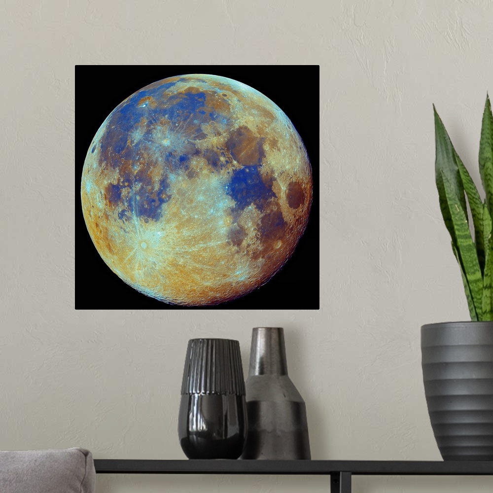 A modern room featuring Square photo on canvas of the moon highlighted in color on a dark backdrop.