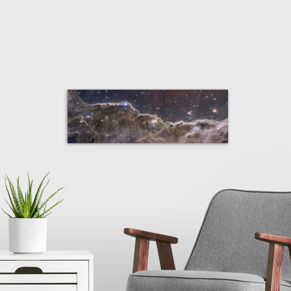 A modern room featuring A never-before-seen view of a star-forming region in the Carina Nebula. Captured in infrared ligh...