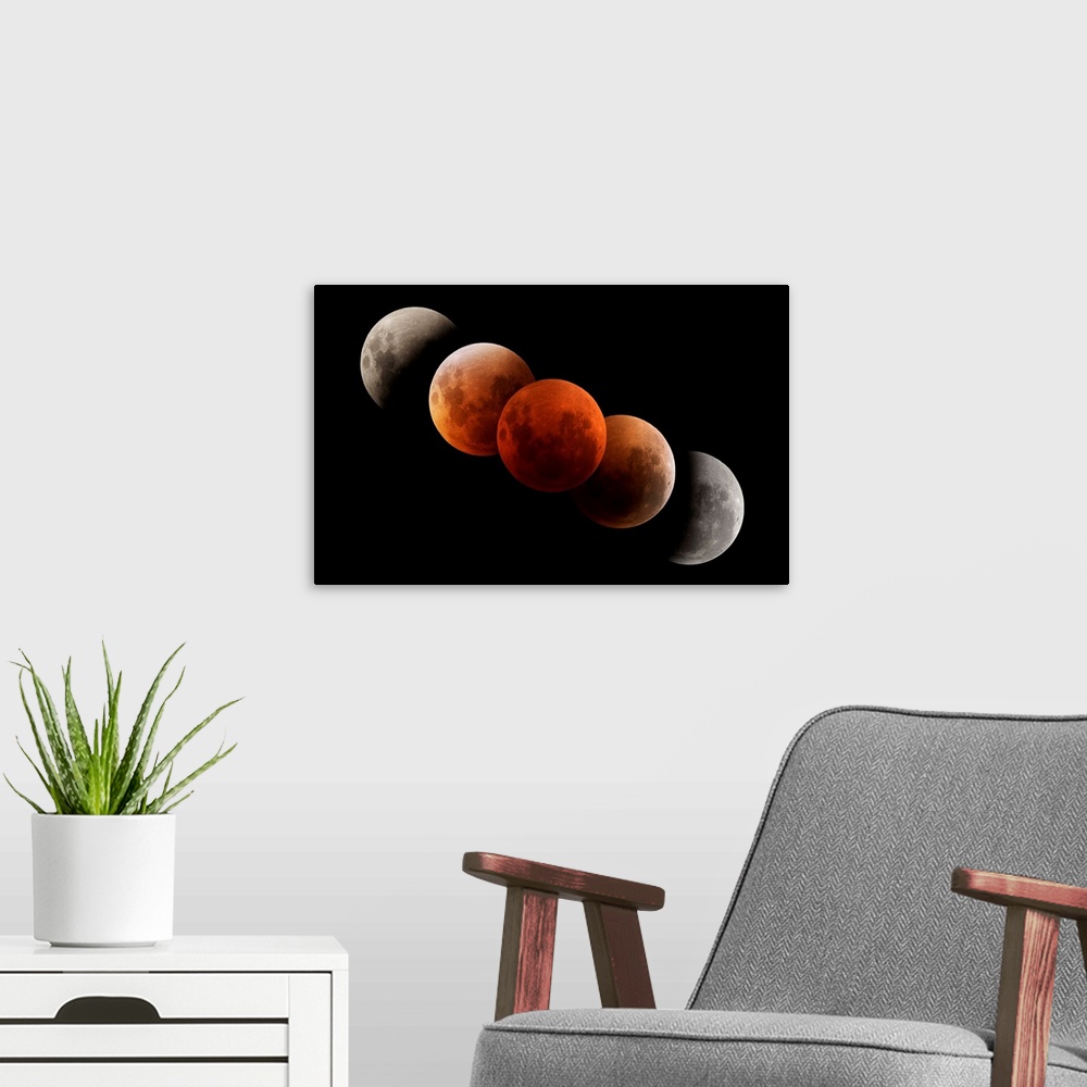 A modern room featuring Composite image of lunar eclipse.
