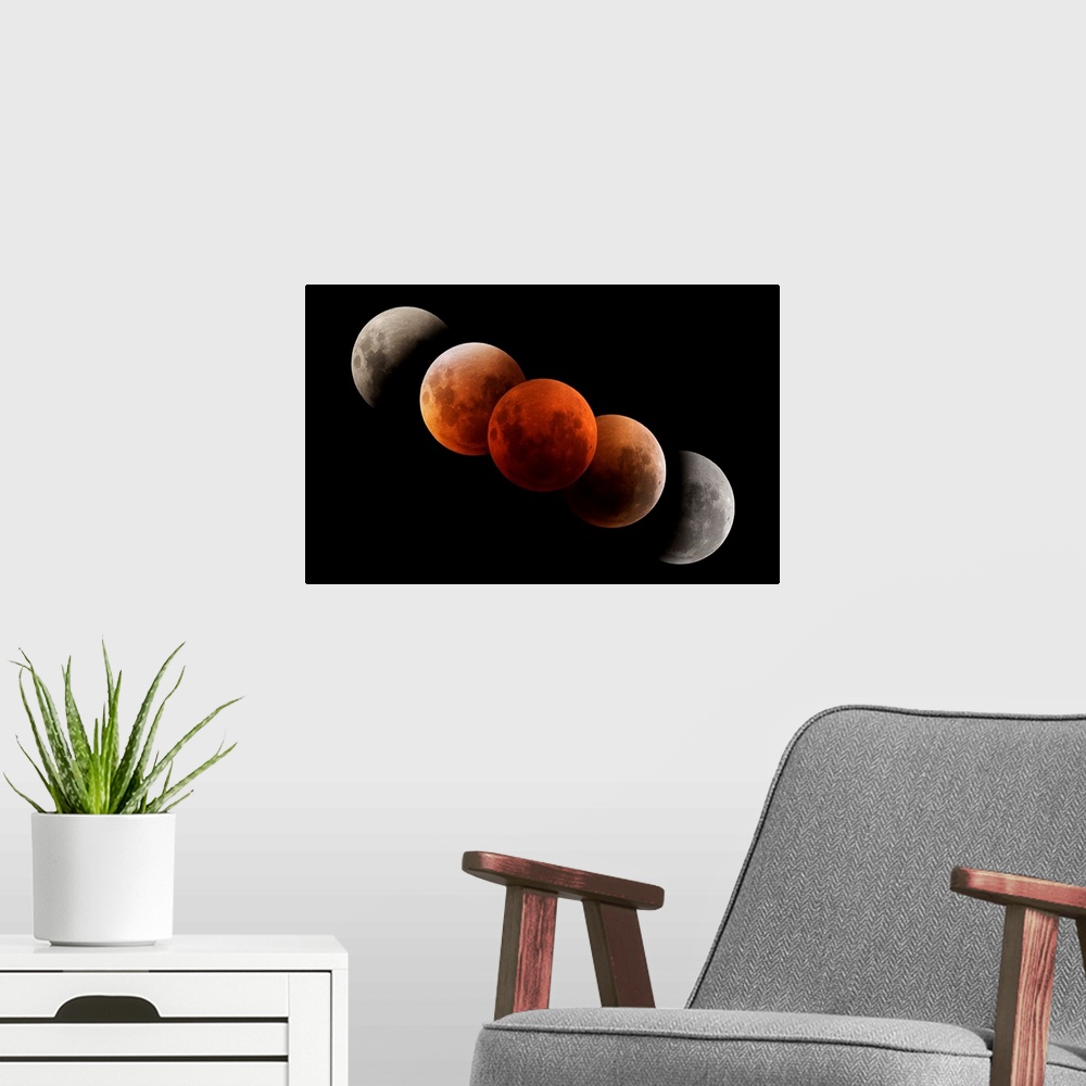 A modern room featuring Composite image of lunar eclipse.