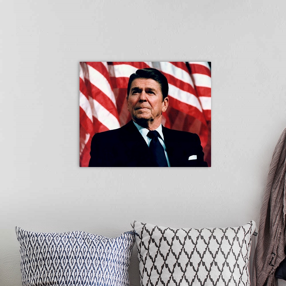 A bohemian room featuring Digitally restored vector photo of President Ronald Reagan speaking in front of American Flags.