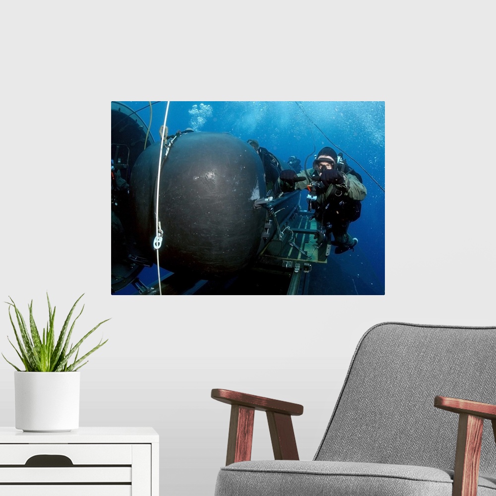 A modern room featuring Divers prepare to launch a SEAL Delivery Vehicle.
