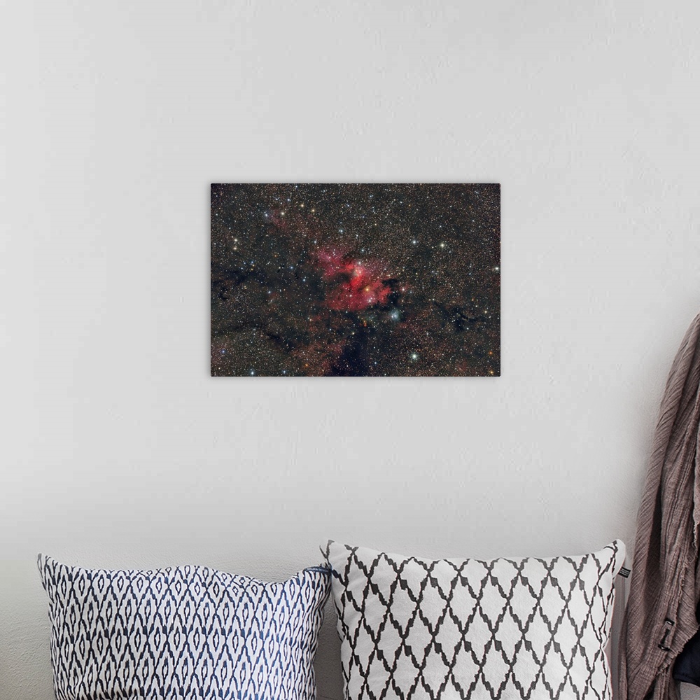 A bohemian room featuring Emission nebula Sh2-155, the Cave Nebula.