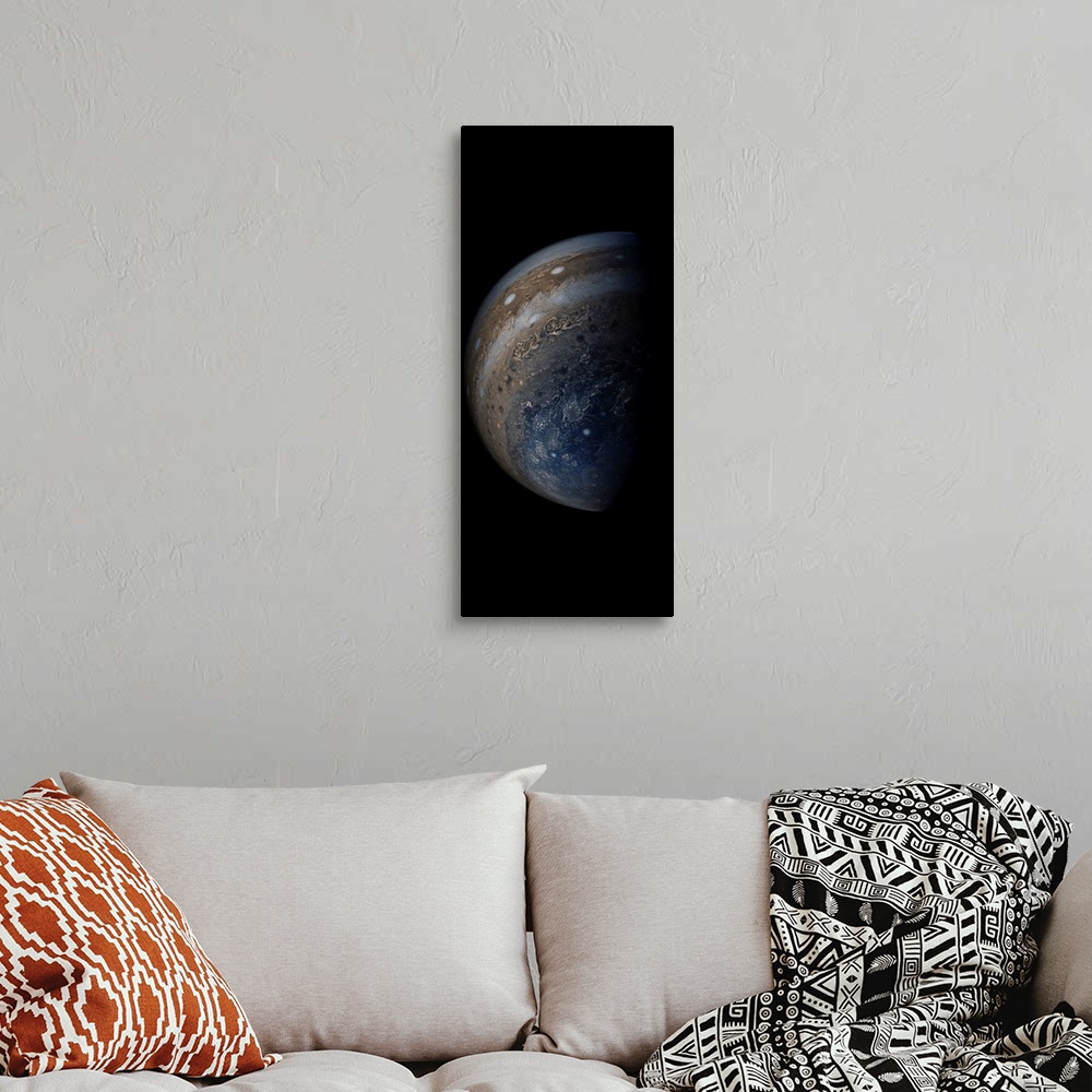 A bohemian room featuring Enhanced color view of planet Jupiter's stormy atmosphere.