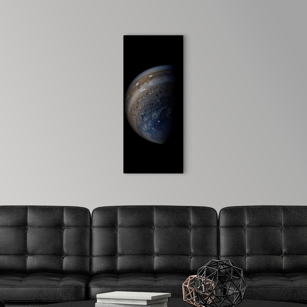 A modern room featuring Enhanced color view of planet Jupiter's stormy atmosphere.