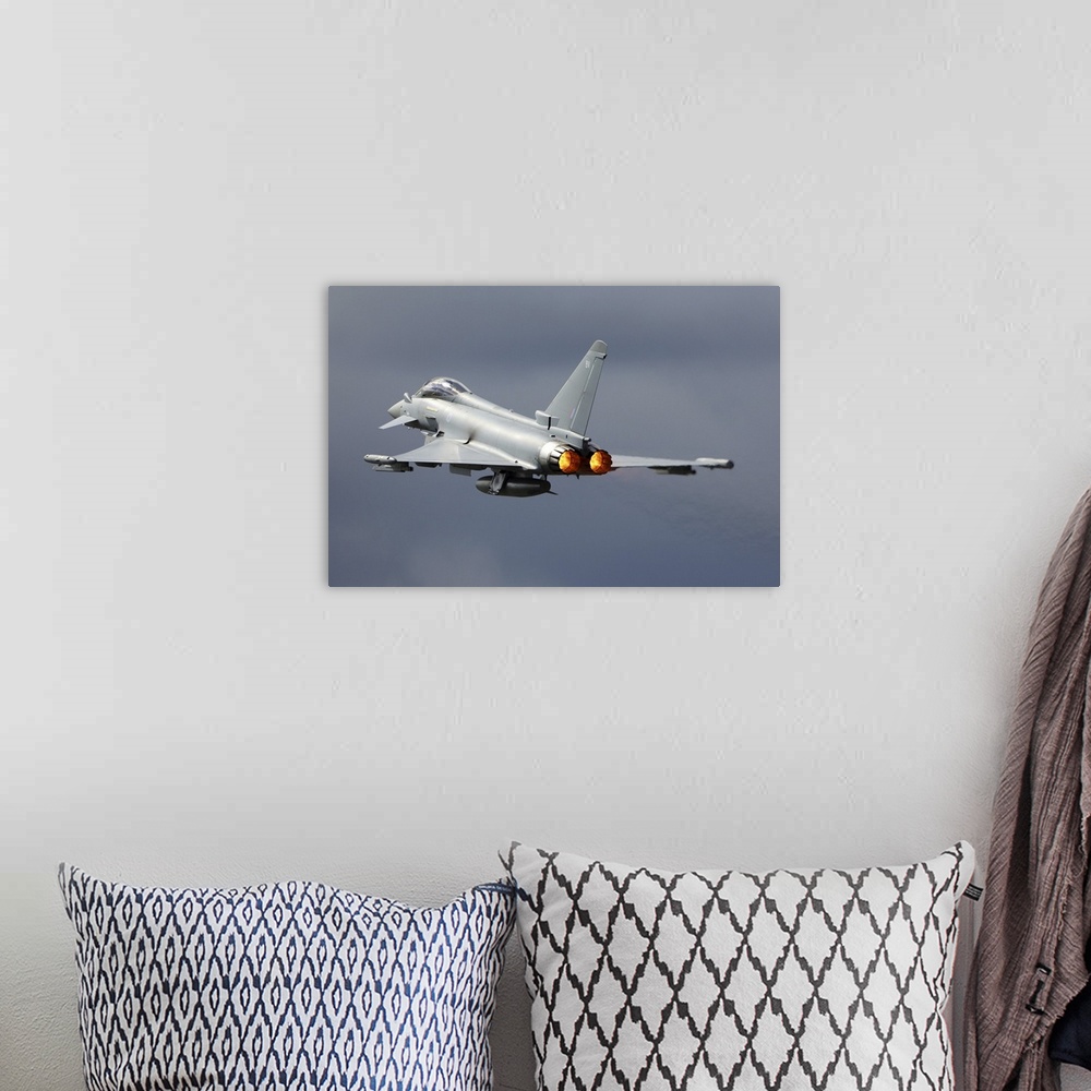 A bohemian room featuring Eurofighter Typhoon FGR4 jet fighter of the Royal Air Force taking off during RIAT-2017 airshow, ...