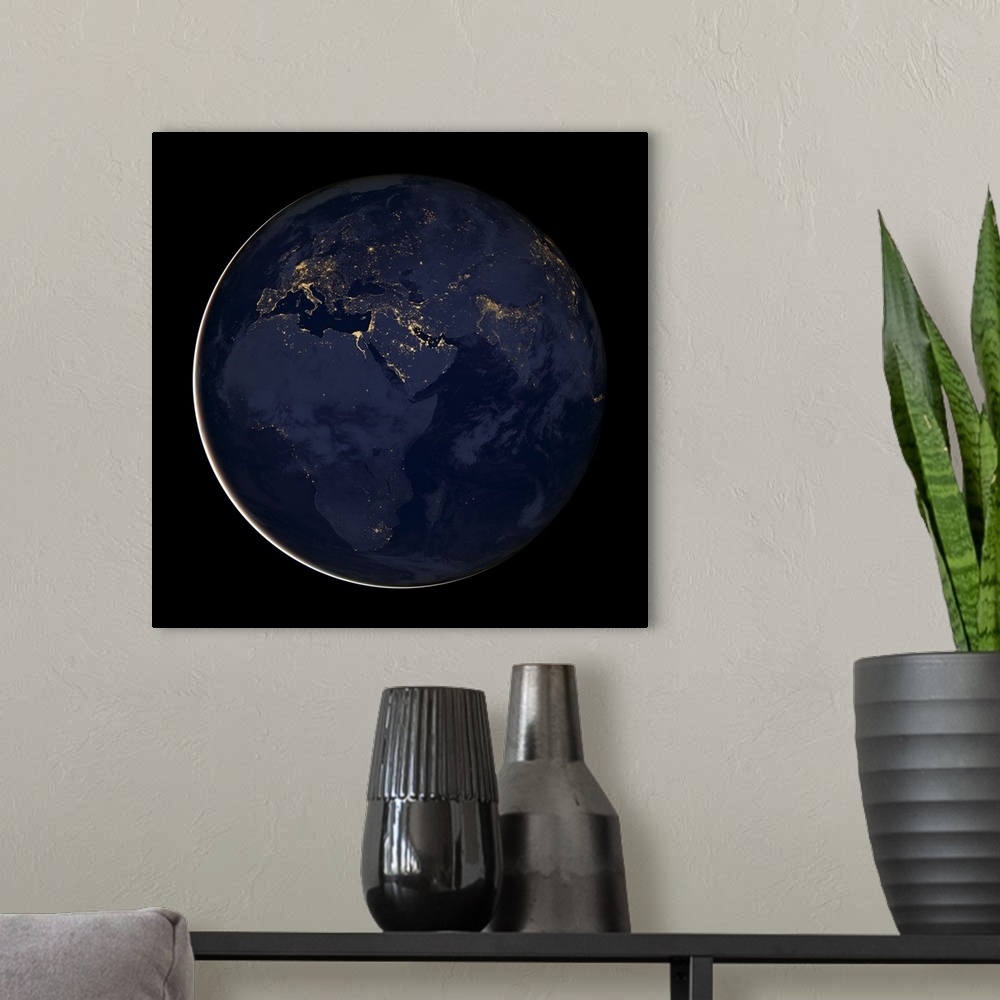 A modern room featuring Europe, Africa and Middle East at night with city lights.
