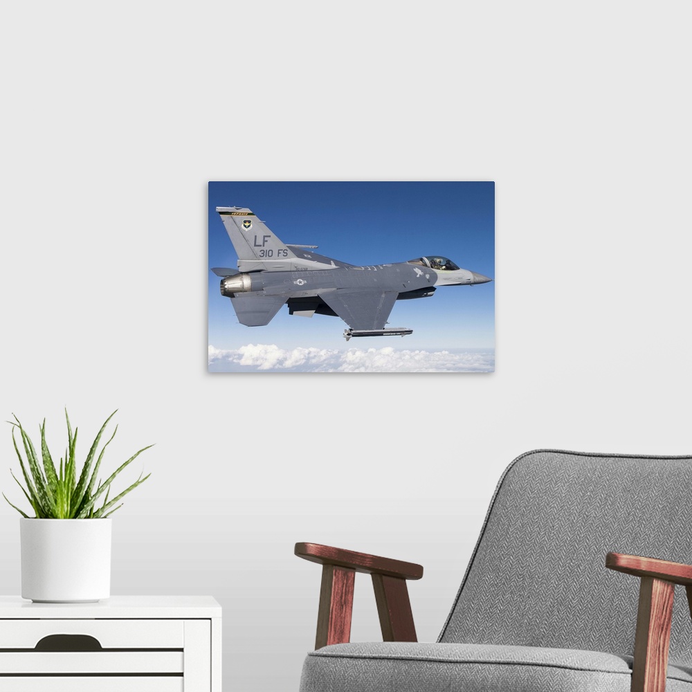 A modern room featuring An F-16C Fighting Falcon during a sortie over Arizona. The F-16C Fighting Falcon is the flagship ...