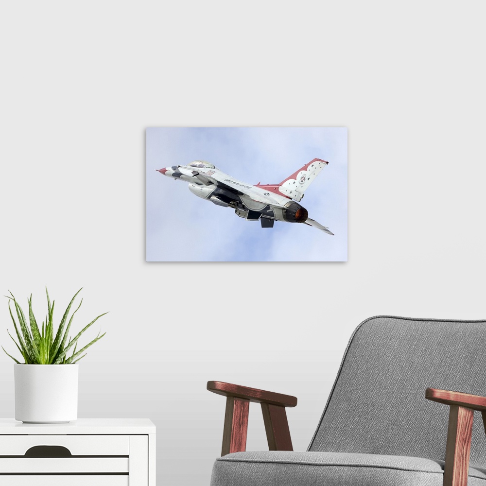 A modern room featuring F-16C Fighting Falcon of U.S. Air Force Thunderbirds air demonstration squadron taking off at RIA...