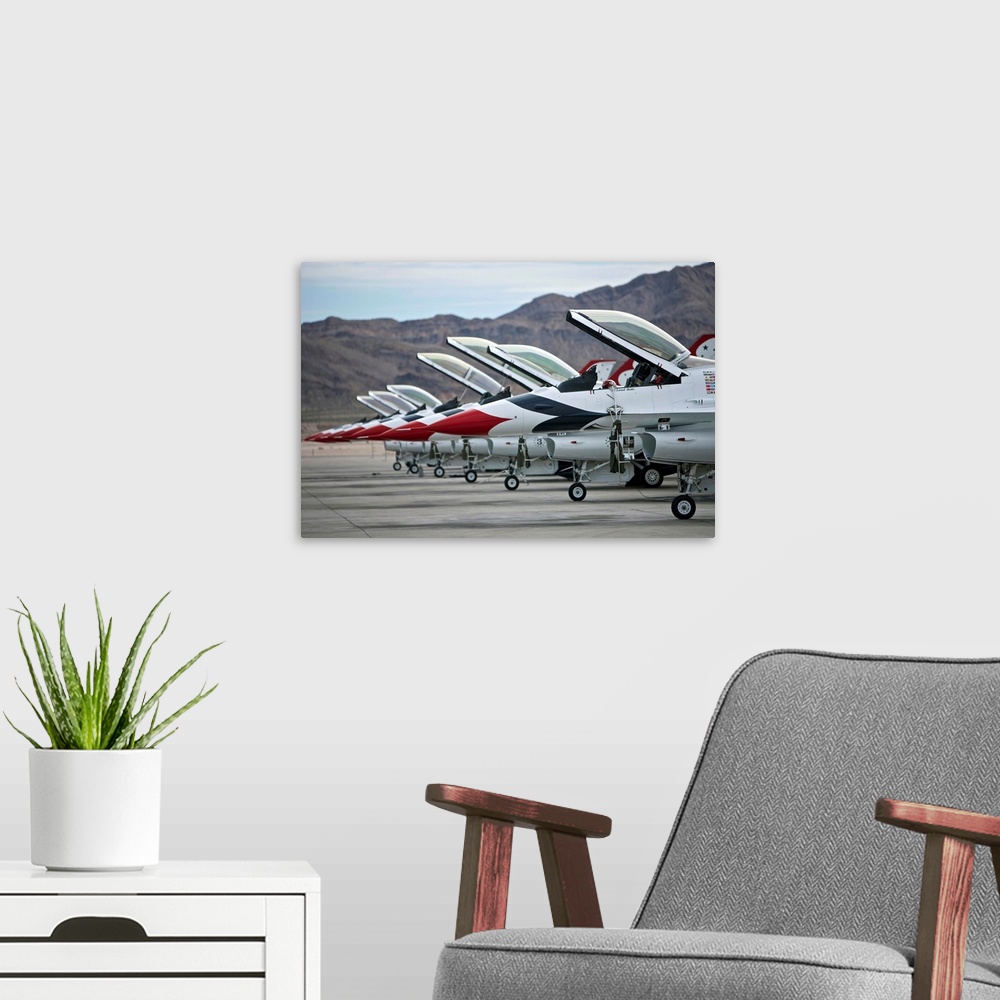A modern room featuring F-16C Thunderbirds on the ramp at Nellis Air Force Base, Nevada.