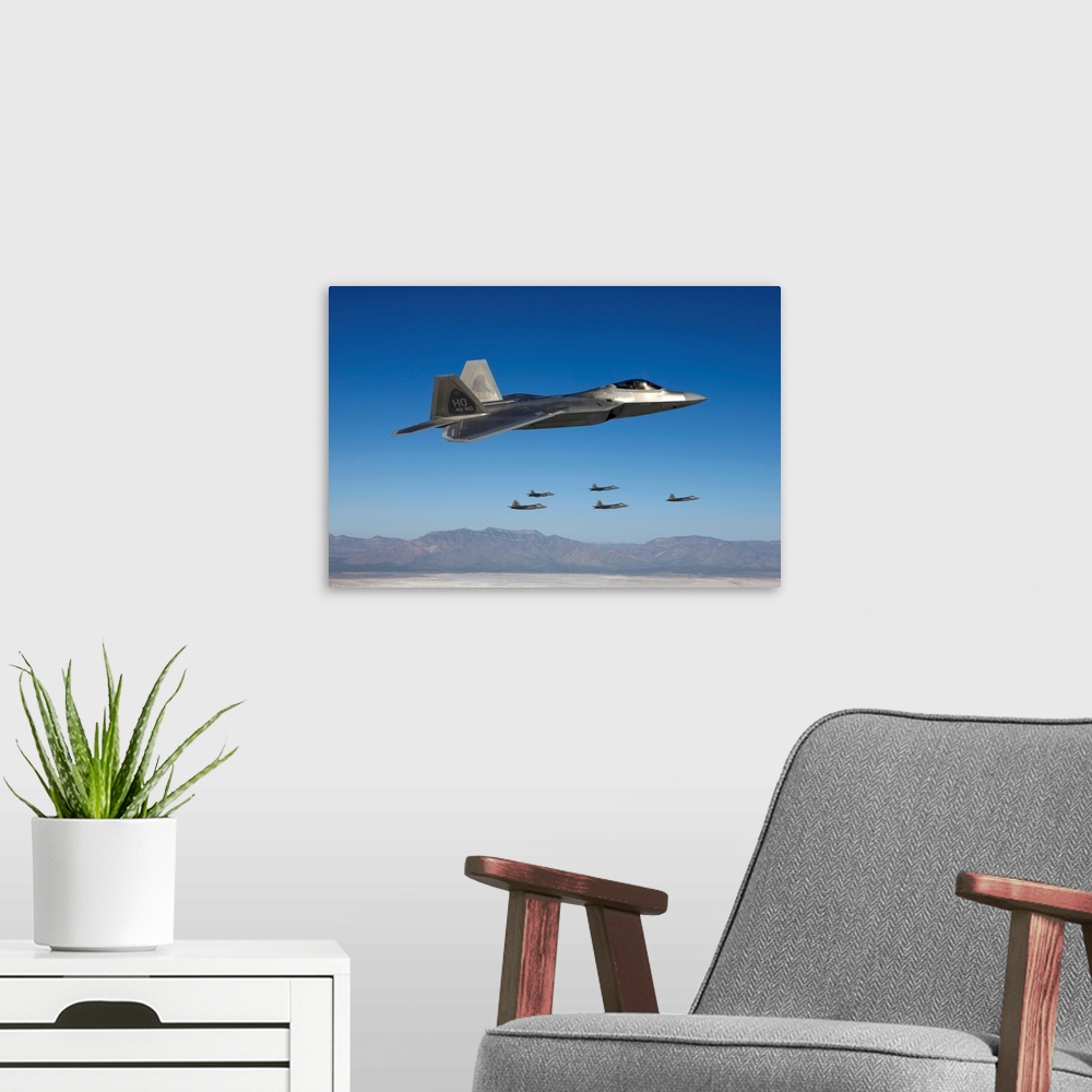 A modern room featuring Six F-22 Raptors fly in formation during a training mission from Holloman Air Force Base, New Mex...
