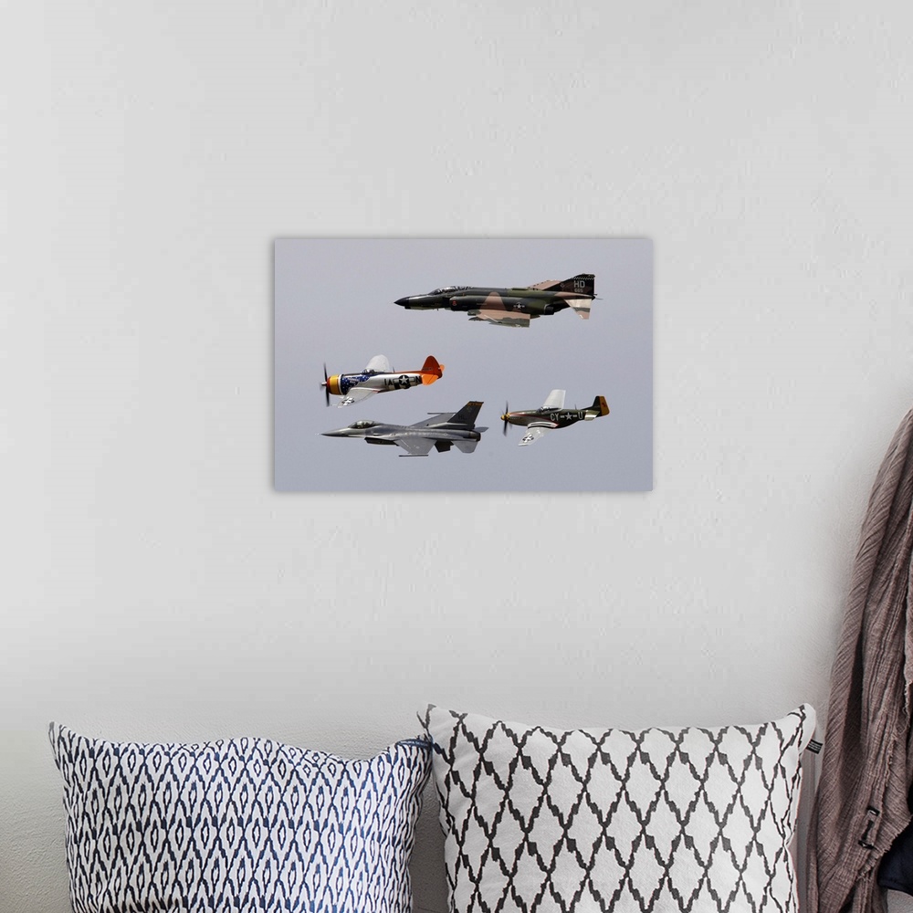 A bohemian room featuring An F-4 Phantom, P-47 Thunderbolt, F-16 Fighting Falcon and P-51 Mustang fly in a heritage flight.