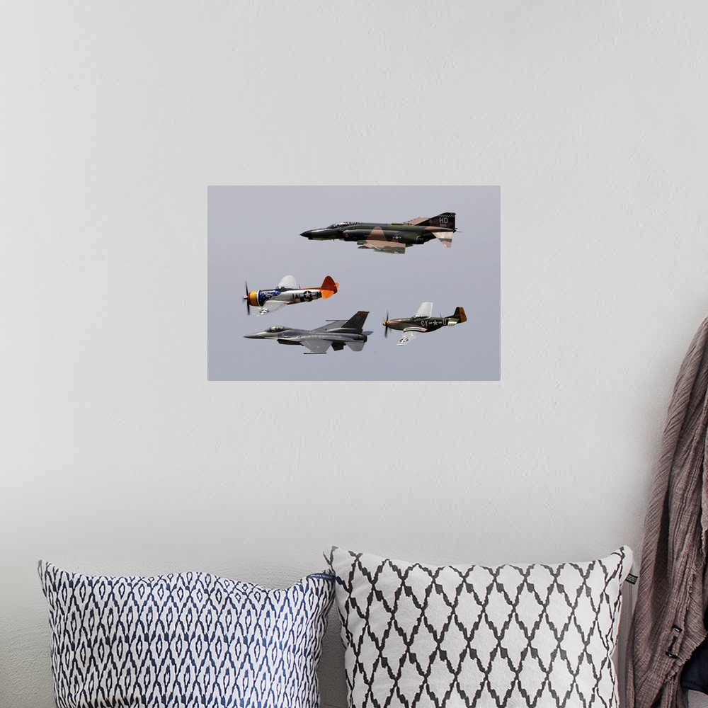 A bohemian room featuring An F-4 Phantom, P-47 Thunderbolt, F-16 Fighting Falcon and P-51 Mustang fly in a heritage flight.