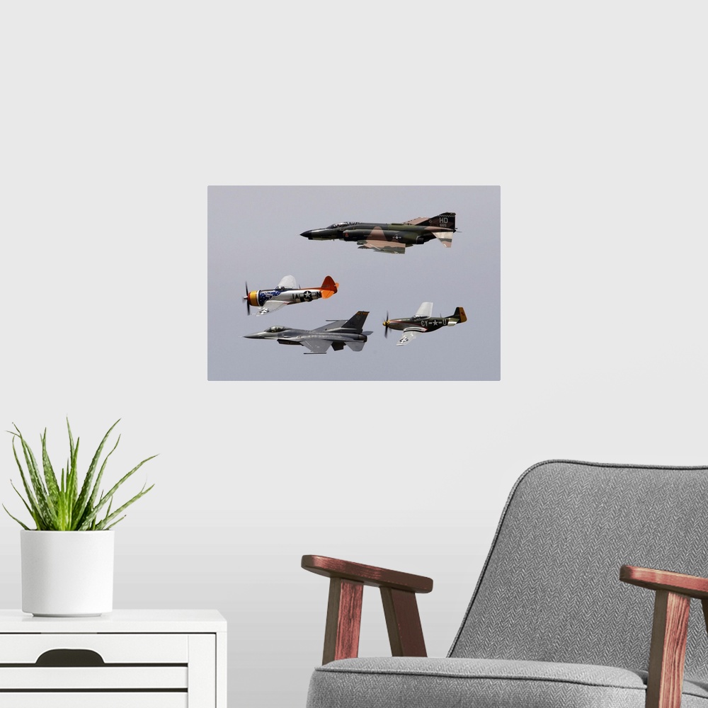 A modern room featuring An F-4 Phantom, P-47 Thunderbolt, F-16 Fighting Falcon and P-51 Mustang fly in a heritage flight.