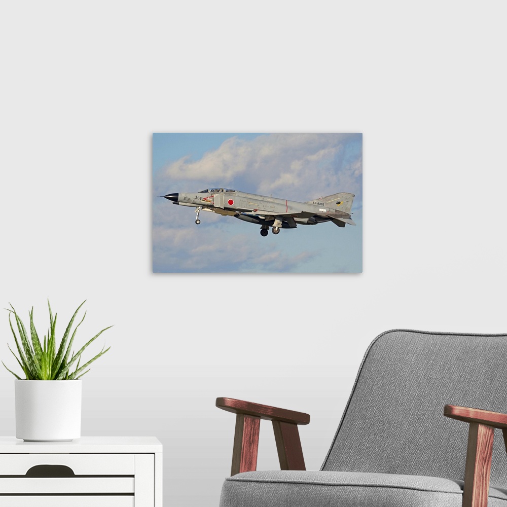 A modern room featuring F4-E Phantom of the Japan Air Self-Defense Force flying over Fallon, Nevada..