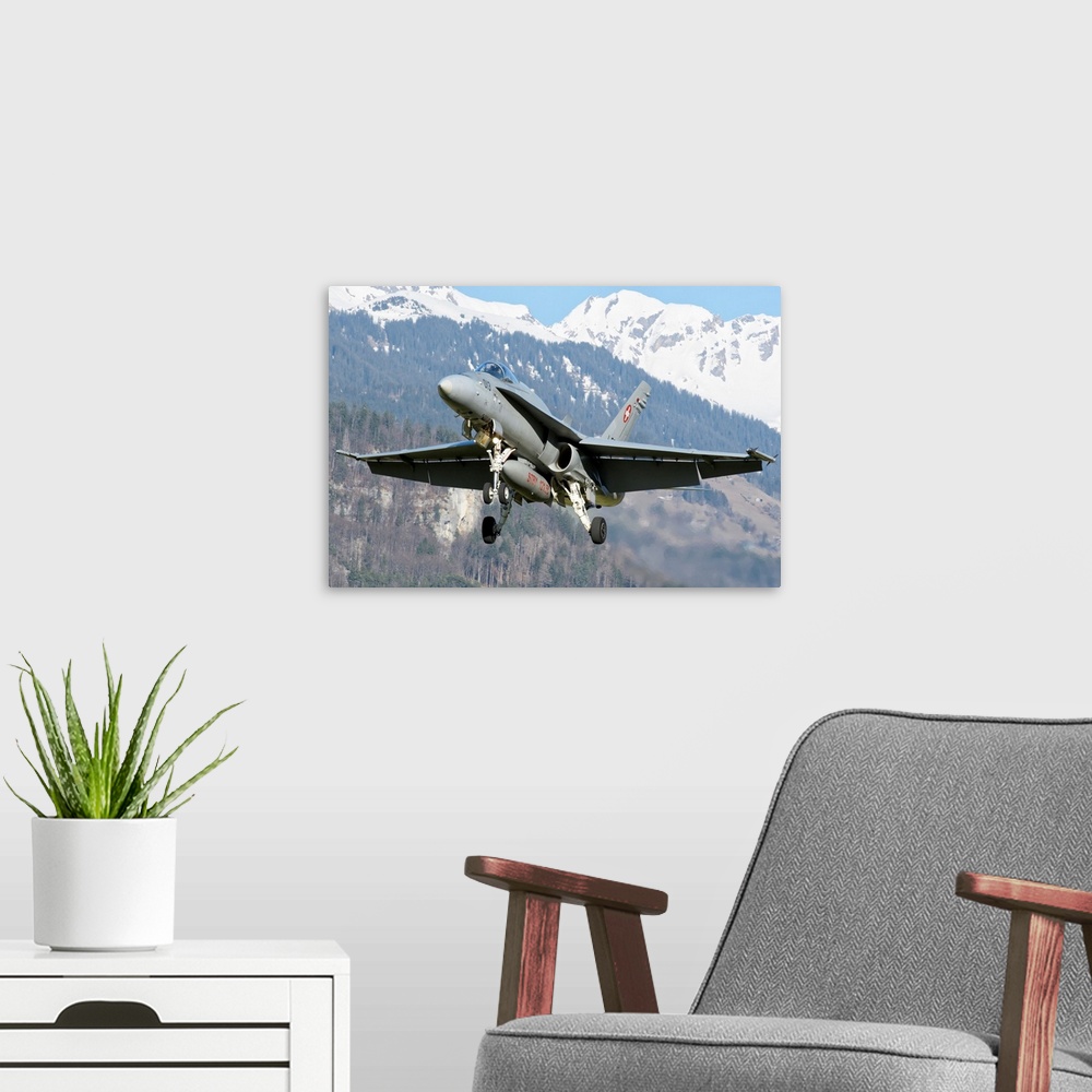 A modern room featuring F/A-18 from the Swiss Air Force landing.