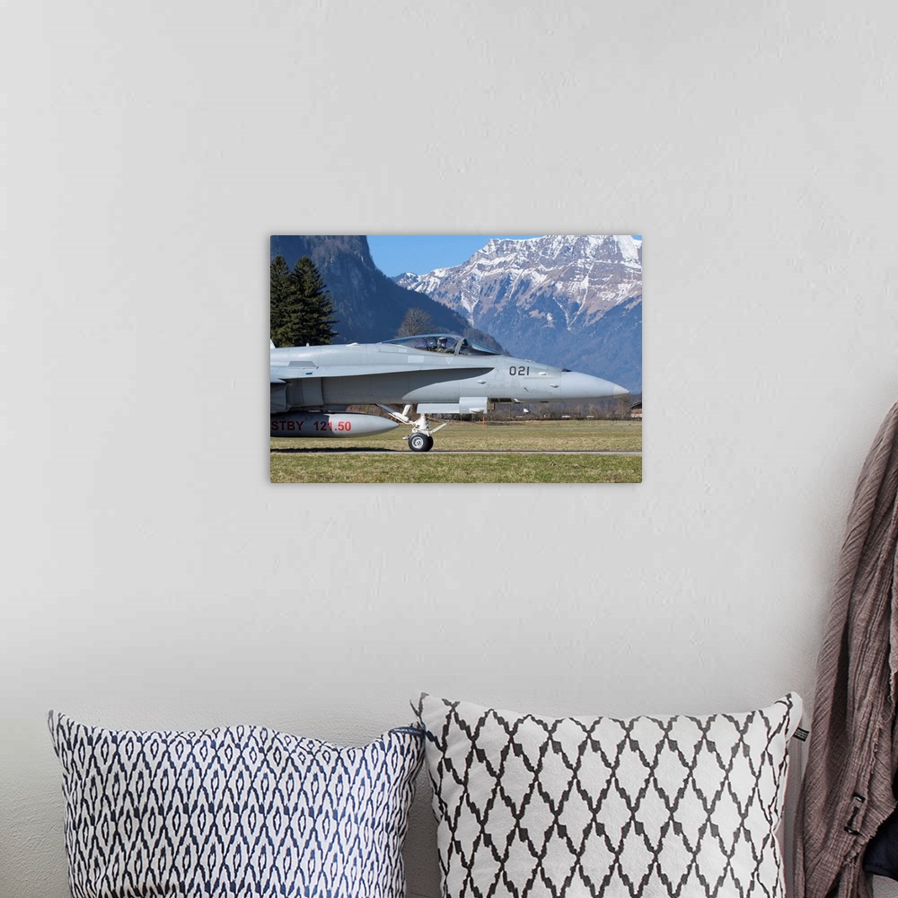 A bohemian room featuring F/A-18 from the Swiss Air Force taxiing at Meiringen Air Base, Switzerland.