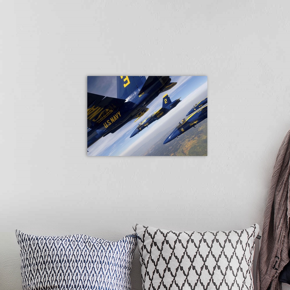 A bohemian room featuring F/A-18 Hornets of the Blue Angels fly in formation over Colorado.
