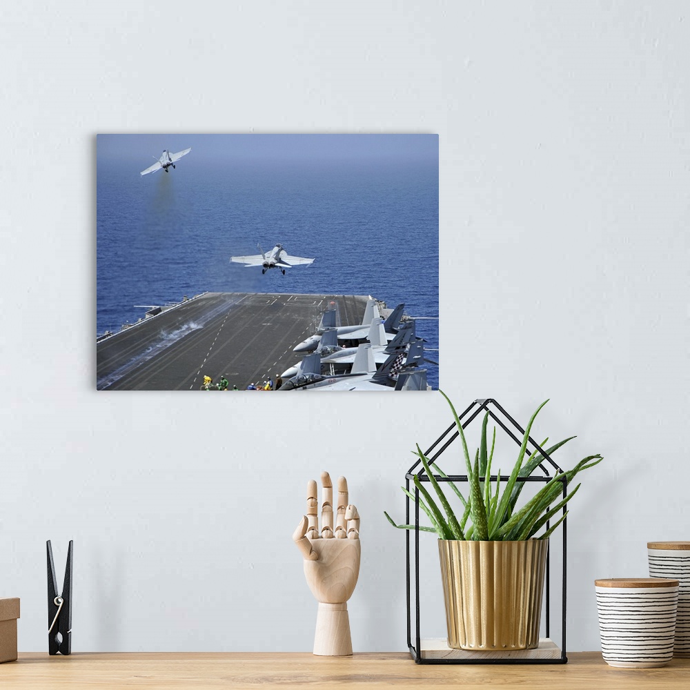 A bohemian room featuring Red Sea, March 17, 2011 - F/A-18F Super Hornets launch from the aircraft carrier USS Enterprise (...