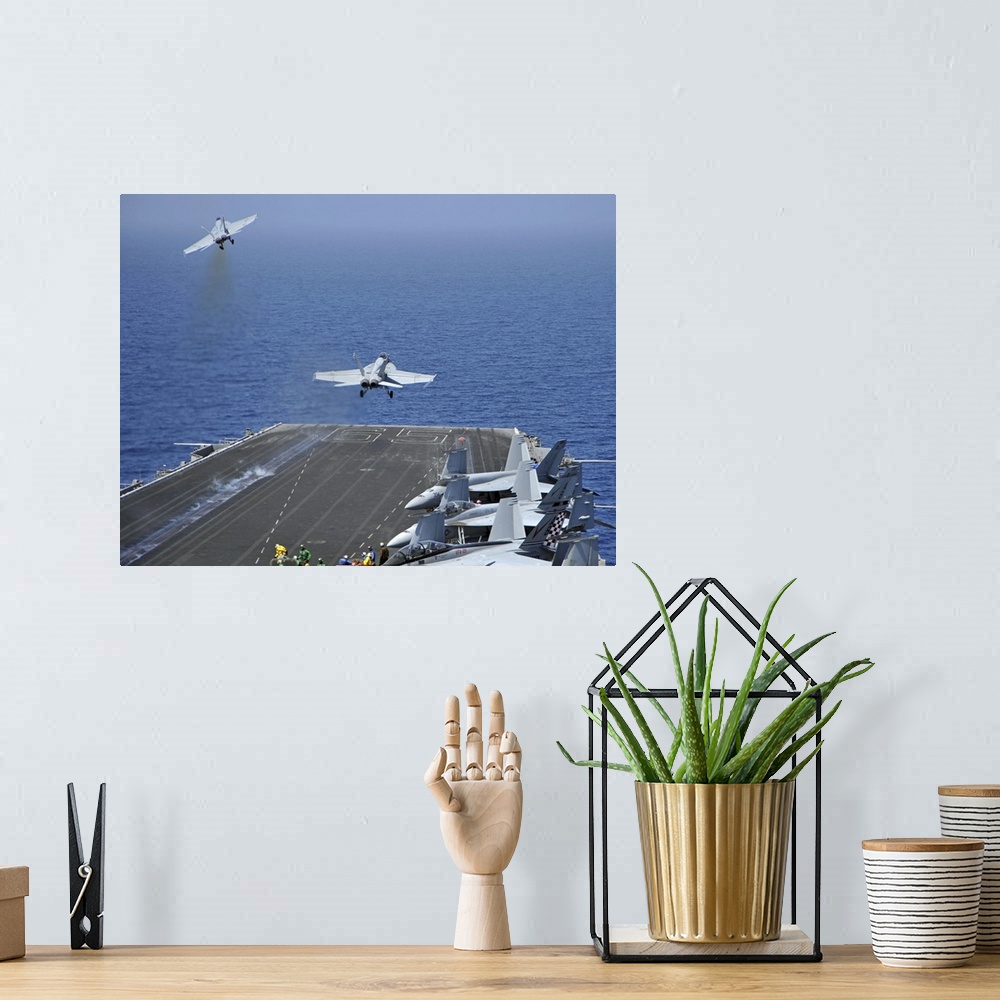 A bohemian room featuring Red Sea, March 17, 2011 - F/A-18F Super Hornets launch from the aircraft carrier USS Enterprise (...